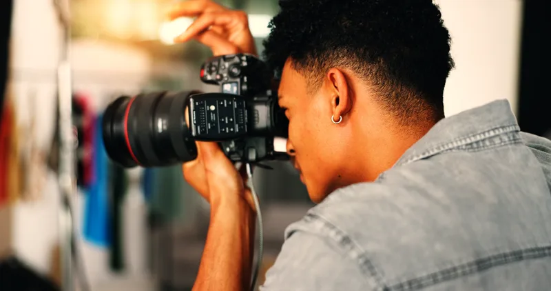A photographer shooting on a DSLR